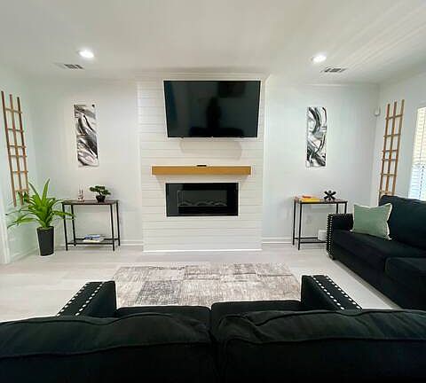 upstairs living room. Furniture not included but for sale