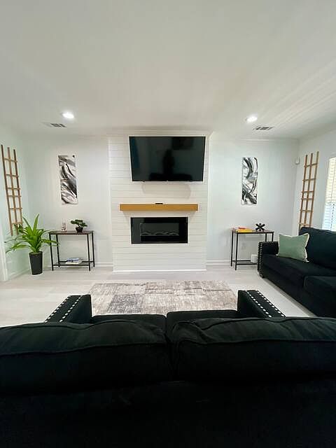 upstairs living room. Furniture not included but for sale