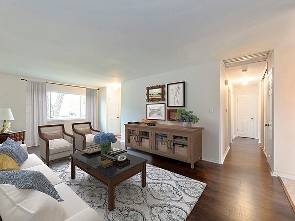 Virtually staged room showing there's plenty of room for a gracious seating arrangement.