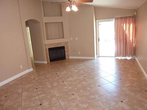 Family Room with Fireplace with Ceiling Fan