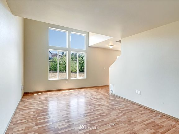 Filled with light, Unit A was just professionally painted throughout. 