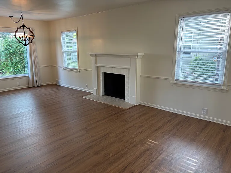 Fireplace in large open living and dining room combination
