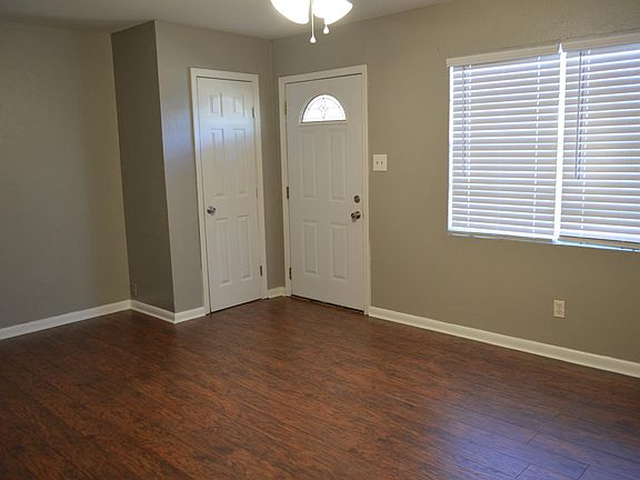 Front entrance into living room with closet