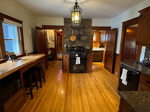 A cozy, golden-lit sanctuary, where the heart of the home pulses with warmth, mystery, and the irresistible lure of freshly baked wonders.