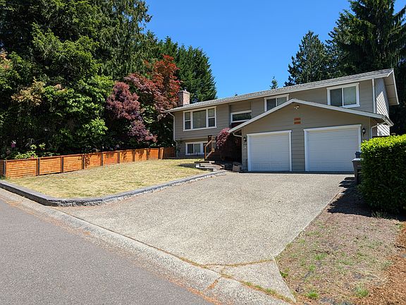 View as you drive up the street, 2 car garage and ample driveway space.