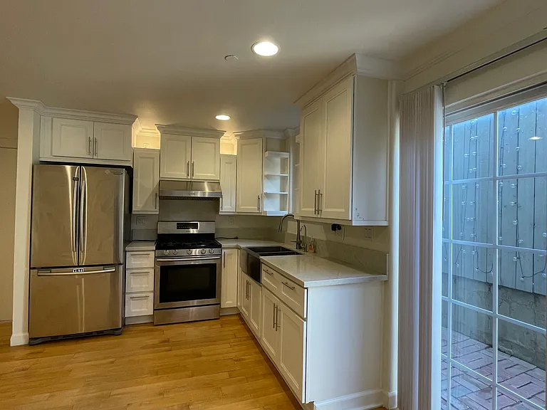 Private back patio space connected to kitchen