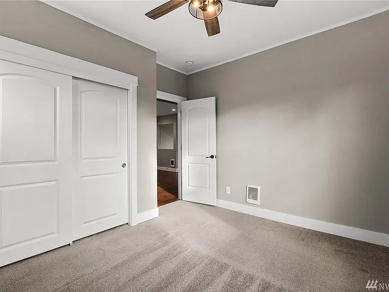 A spacious main-level bedroom offering comfort, flexibility, and convenient access to the beautifully remodeled full bath.