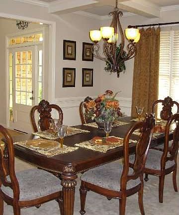 Dining Room with coffered ceilings and chair rail