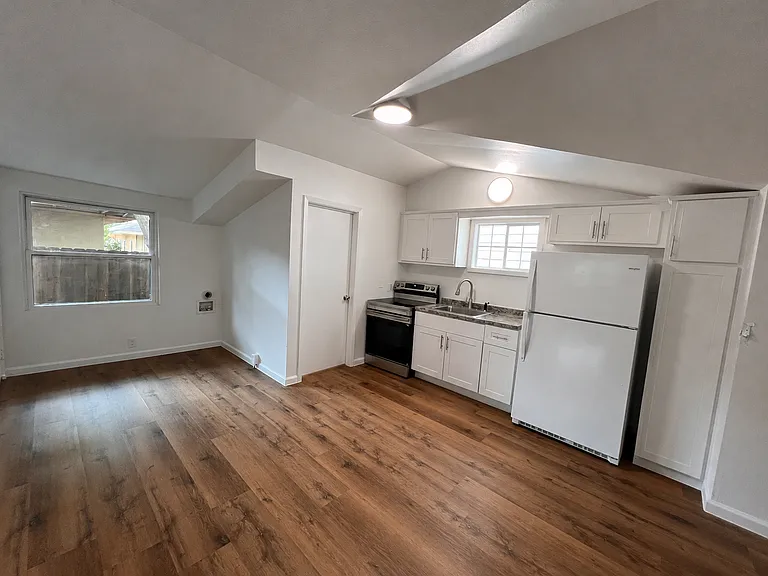 Beautiful fully repainted kitchen with luxury vinyl wood planks.