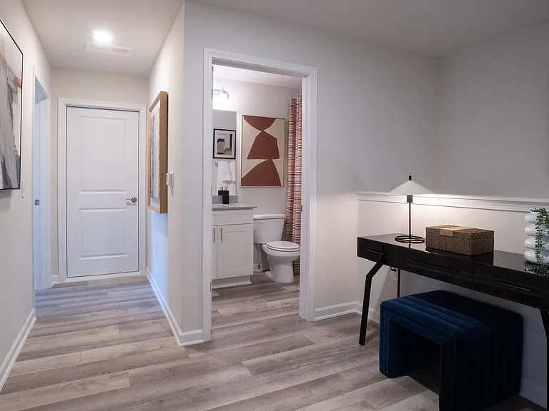 Hallway/loft area on the second floor, looking into secondary bathroom.