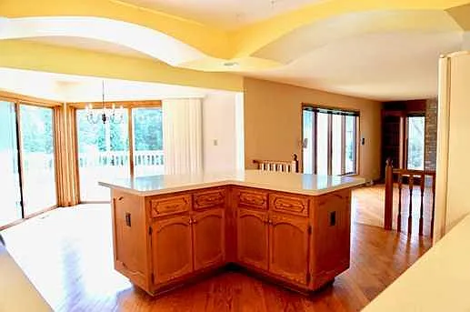 Empty kitchen with breakfast area and Family Room