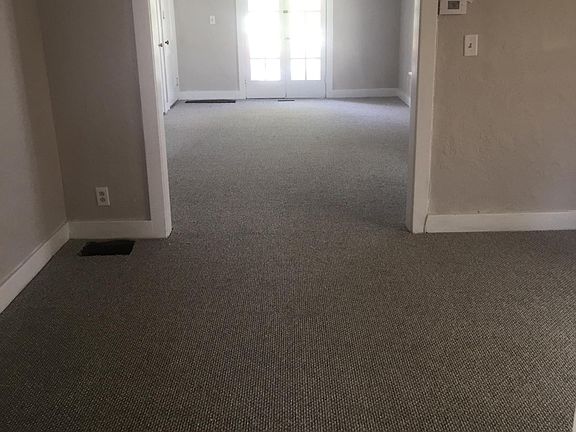 Standing in dinning room looking into living room with french doors