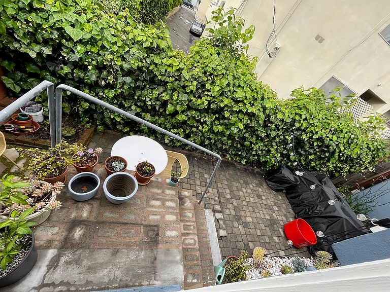 Private back patio with enough space for a BBQ, patio set, and more.