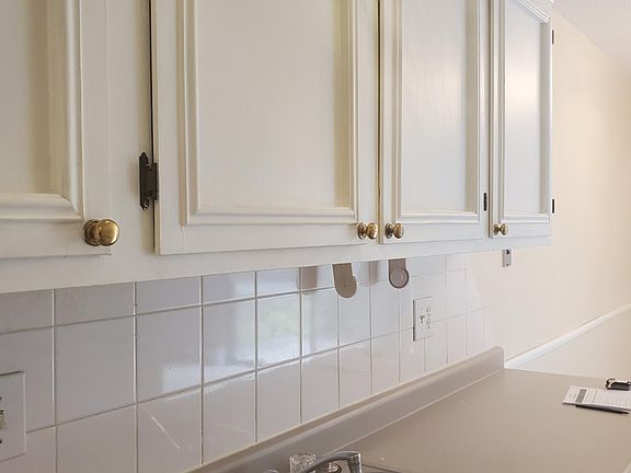 Kitchen, howing the sink with the garbage disposal.