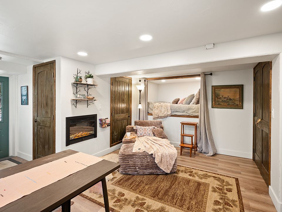 Cozy up to the fireplace to watch a movie on the Smart TV or the sunset out your large windows.