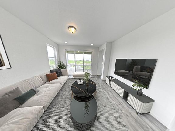 Living room opens to Private Balcony with unobstructed view of the sunrise.