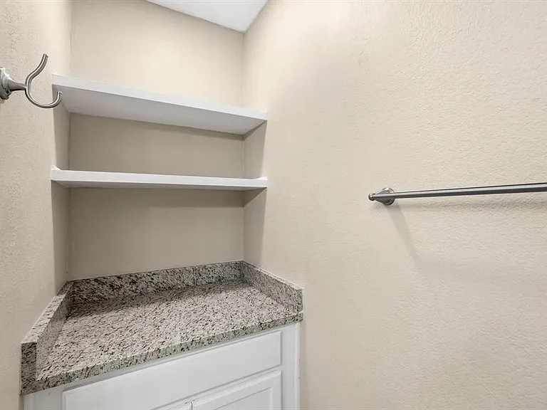 Bathroom featuring a textured wall