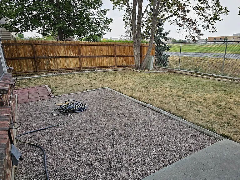 Back yard (privacy fence between neighbors, chain link facing middle school)
