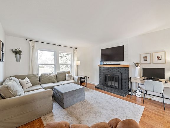 Bright and airy living area with large windows allowing ample natural light