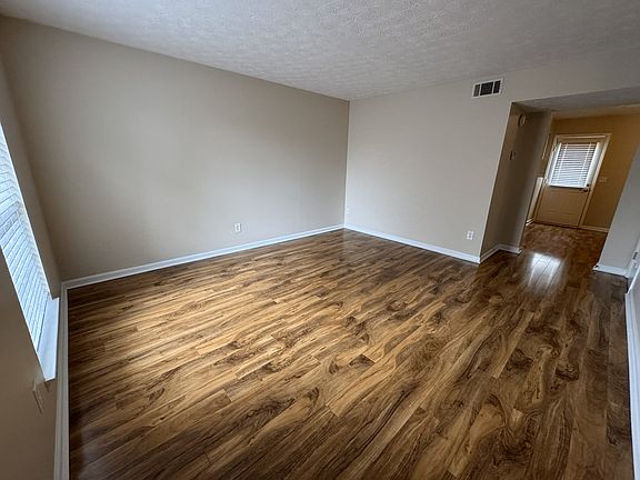Living Room with hard wood floors in a 2 bedroom 1.5 bath in Hermitage Tennessee offered by Income Properties, Inc.
