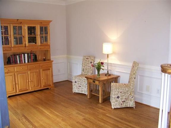 Separate formal living and dining rooms with hardwoods.