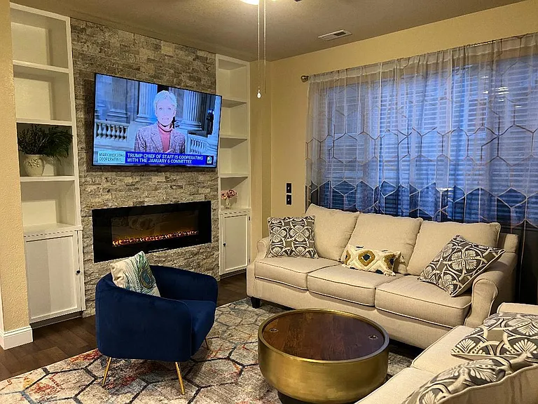 Living room with fireplace and bookshelf