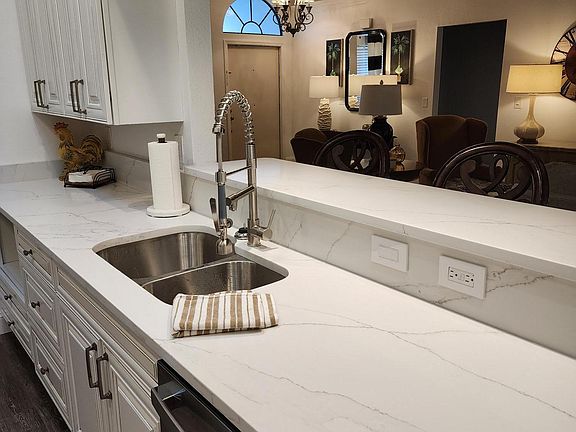 Brand new gourmet kitchen with quartz countertops and all brand new cabinets and appliances. The kitchen is open to the family room so everyone can be together. Great counter space for making a meal for yourself or a group.