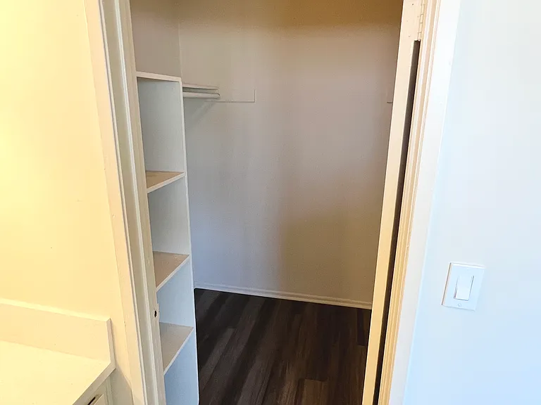 Walk in closet in the regular one bedroom unit