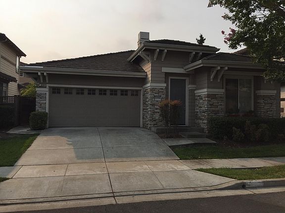 frontal view of house in quiet neighborhood