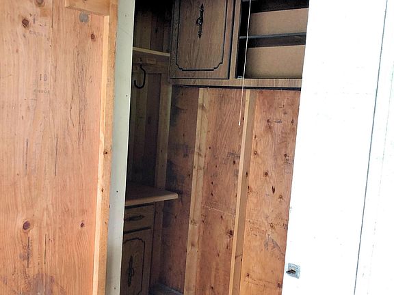 Additional storage unit in the carport.