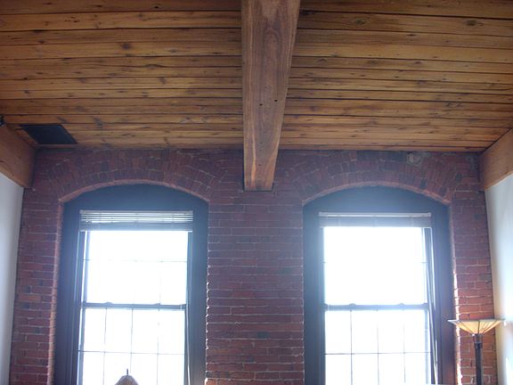 Sun filled. High ceilings. Exposed Brick/Beam. Efficient win