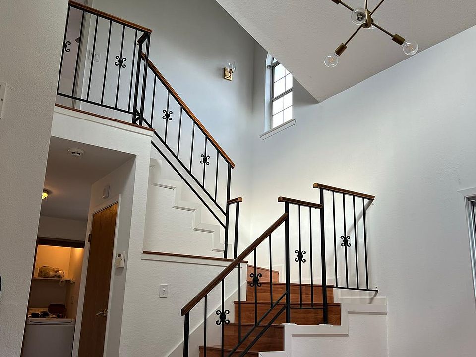 staircase with very high ceilings