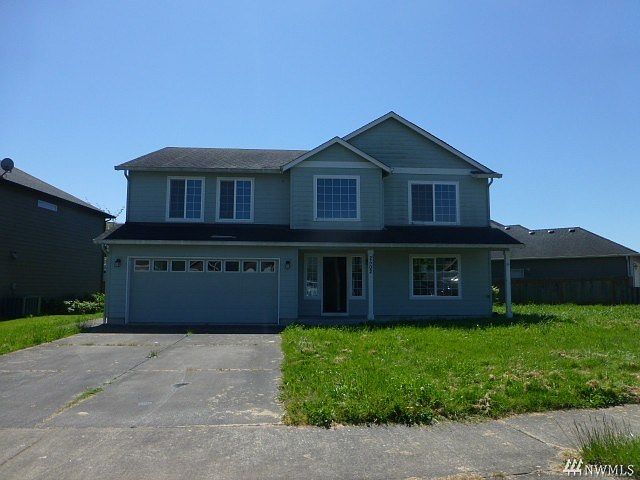 Front of home with a 2-car garage, more vehicles no problem, driveway and on the street parking.