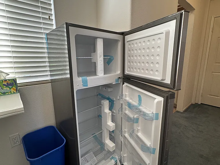 New refrigerator in common area for tenant use