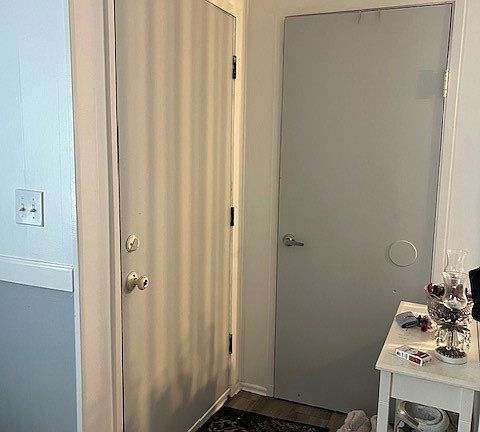 Entry area for unit A with a coat closet.>