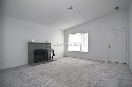 LIVING ROOM W/COZY FIREPLACE.