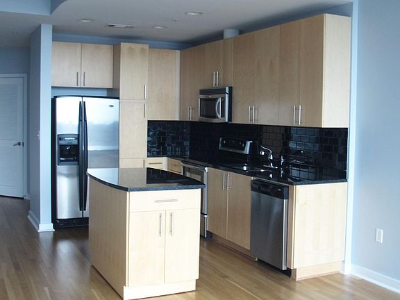 Kitchen: Stainless steel appliances, granite countertop, hardwood floors