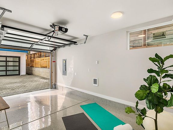Fully finished garage perfect for home gym, office, or parking!
