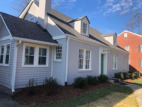 Sunroom on far left; large front and back yard
