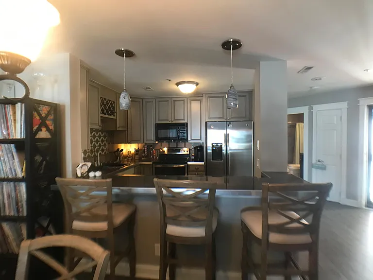 Kitchen with Double ovens and Side By Side Refrigerator
