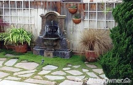 Wonderful sitting room overlooking patio
						:
						outside the sitting room the interior patio with slate tile & interior courtyard