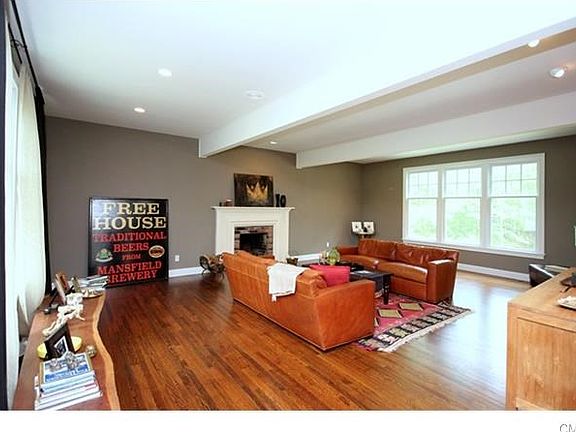 Sunken Living Room with 10 ft. ceilings, fireplace and lots of windows letting in the natural light