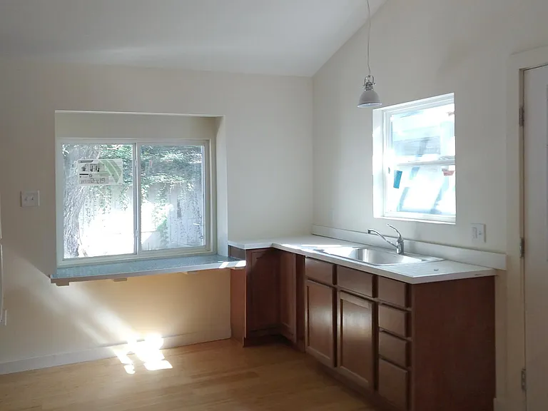 Kitchen area - sink, counter, cabinets