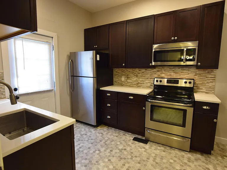 Built-in microwave, stainless oven and fridge