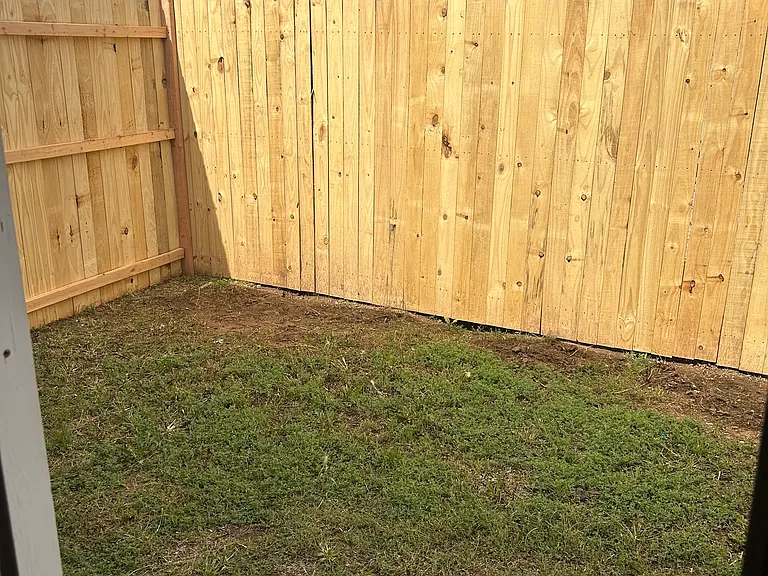 New fenced in backyard.