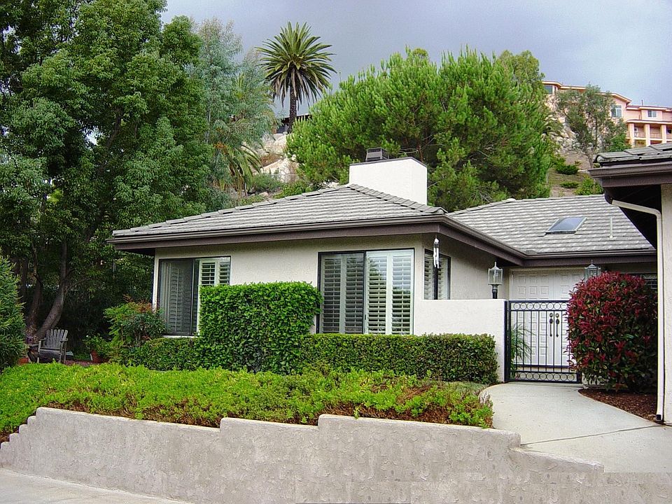 Front of home with gated courtyyard