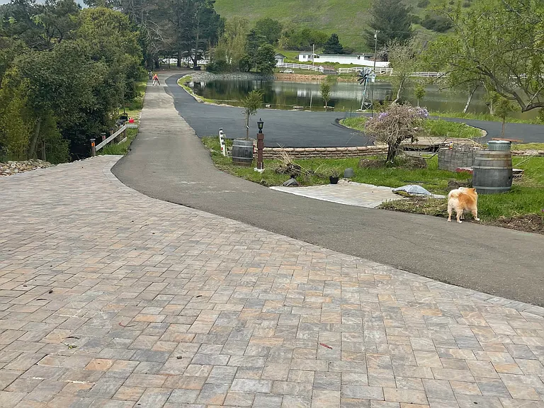 long driveway (pavers at front of home)