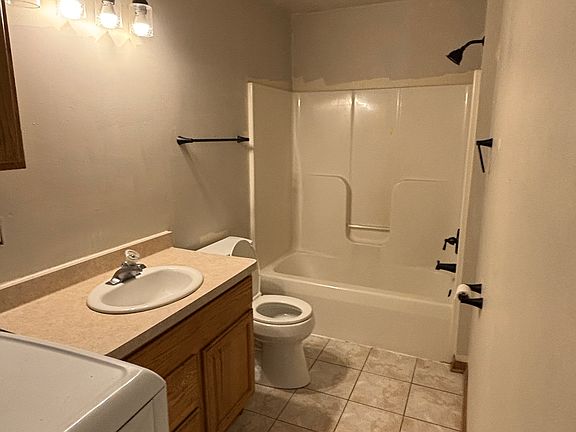 Lower bathroom with laundry