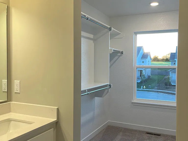 Walki-in closet in master bathroom
