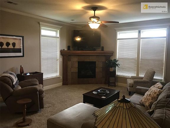 Great room with gas fireplace and window coverings